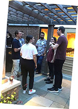 A group of graduate students on patio
